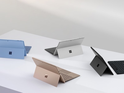 Four Surface Pro devices in Sapphire, Dune, Platinum, and Black.