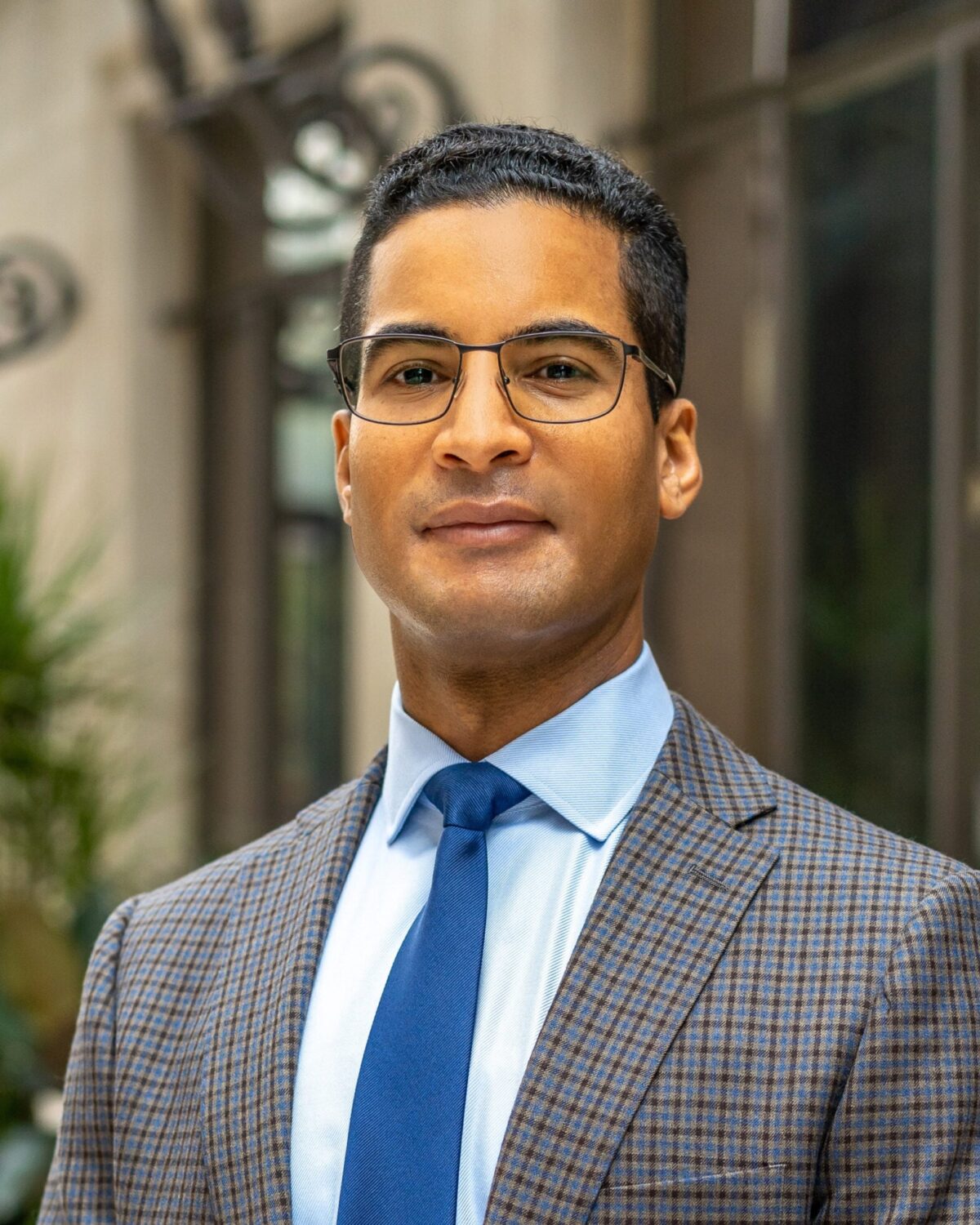 Professor Richard Albert, wearing a gray checked suit and blue tie