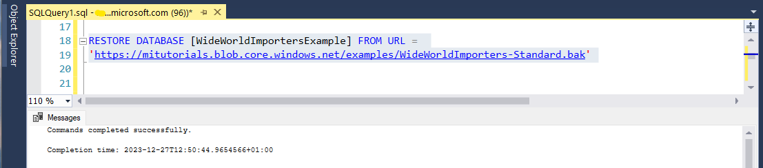 Screenshot that shows the SSMS Query Editor. The RESTORE DATABASE statement is visible, and a message indicates that the query ran successfully.