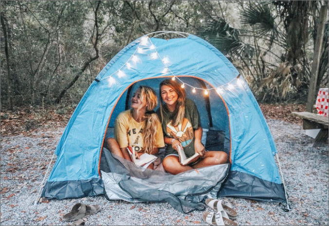 two girls in a tent