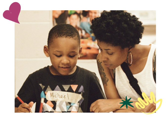 woman helping a child in school