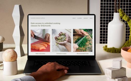 Laptop on a counter surrounded by decor, displaying a secure Squarespace website