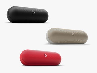 3 ovalshaped portable speakers in black gold and red