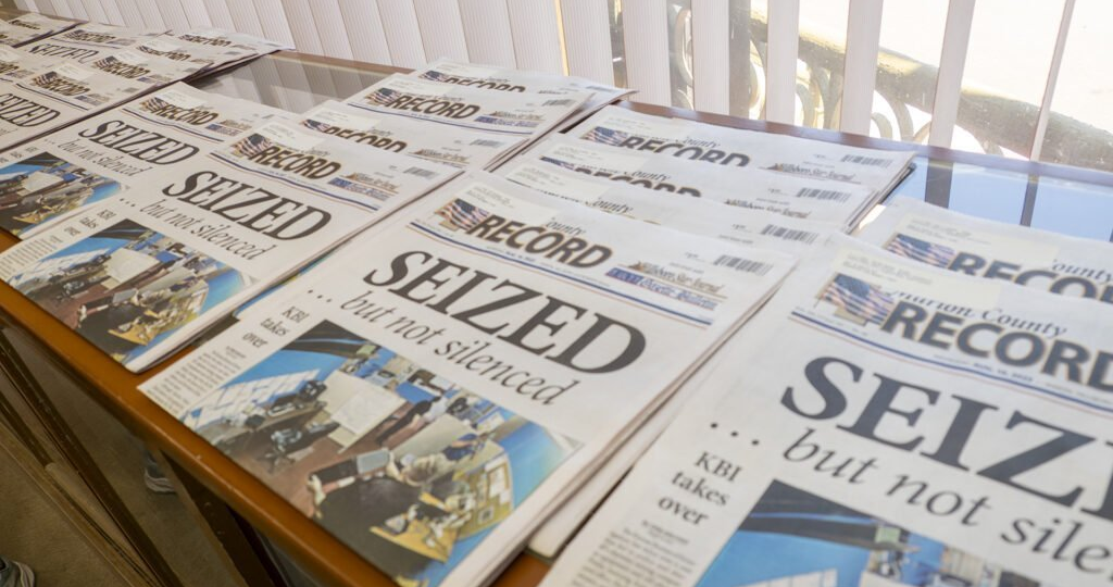 Newspapers with the word 'Seized' as a headline