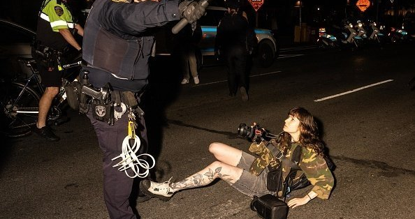 A journalist is knocked to the ground in New York City