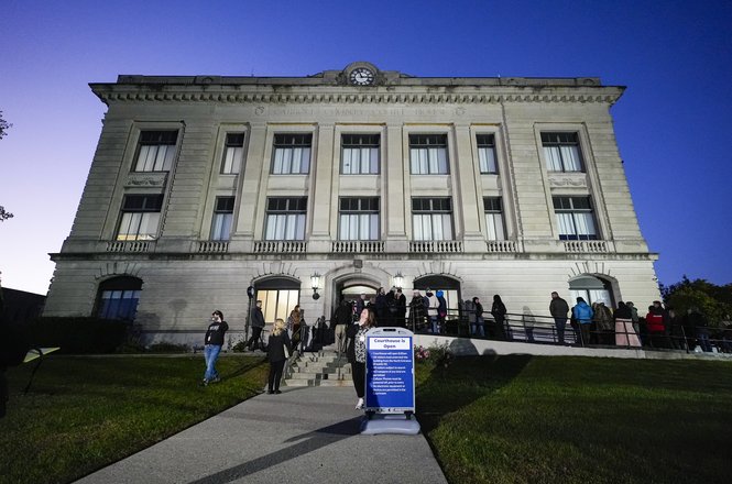 Associated Press photojournalist Michael Conroy photographed spectators lined up at Carroll County Courthouse in Delphi, Indiana, for a murder trial starting on Oct. 18, 2024. His cameras were believed to have been seized by authorities shortly after.