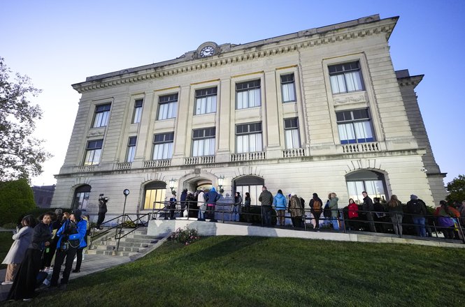 Spectators line up to enter the Carroll County Courthouse in Delphi, Indiana, to observe a murder trial starting on Oct. 18, 2024. Authorities seized two cameras belonging to Journal & Courier photojournalist Alex Martin outside the courthouse.