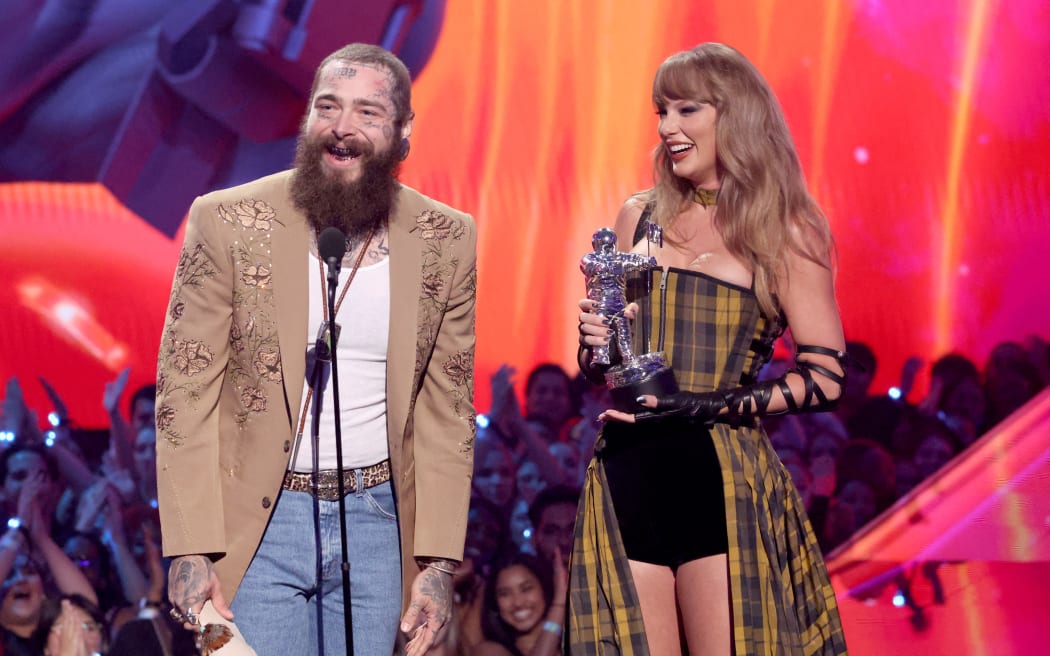 Post Malone and Taylor Swift accept the Best Collaboration award for "Fortnight" on stage during the 2024 MTV Video Music Awards at UBS Arena on September 11, 2024 in Elmont, New York.