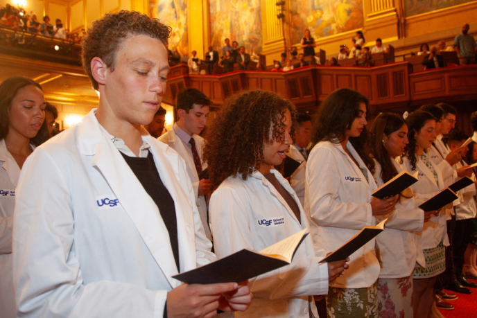 The class of 2028 reads from the Physician's Declaration at this year's White Coat ceremony