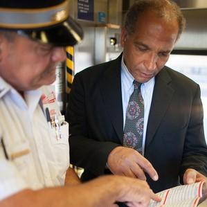 Metra conductor helping rider