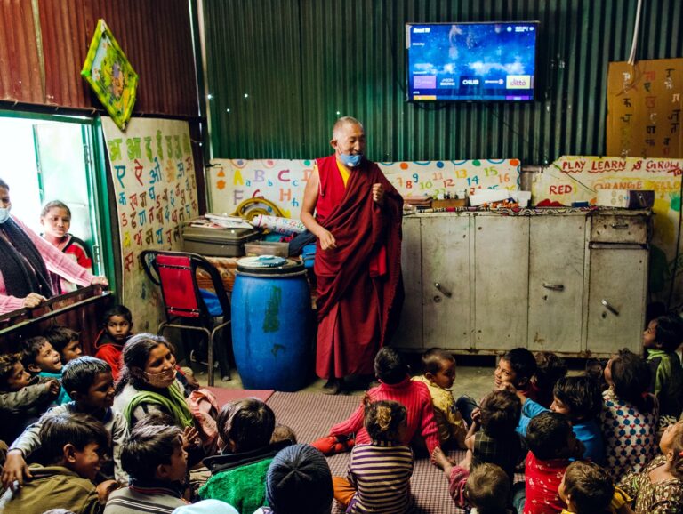 man speaking to children