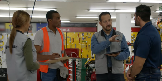 Retail team of four in a meeting in a store