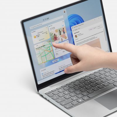 Person using touchscreen on Surface Laptop Go 2