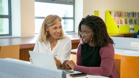 Two women in a classroom