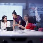 brand image - Diverse group of a team of co-workers having a meeting in a conference room.