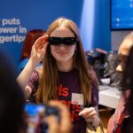 GBiT event -- girl wearing Lenovo AR headset.