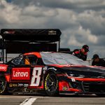 NASCAR car with Lenovo sponsorship logos.