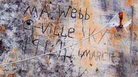 Marshall Webb's carving can still be seen on a wall in Tremensuoli, Italy