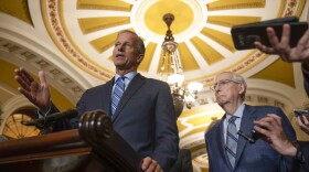 Sen. John Thune, R-S.D., speaks as Sen. Mitch McConnell, R-Ky., listens during a media availability on Capitol Hill, Tuesday, Sept. 12, 2023 in Washington. (AP Photo/Mark Schiefelbein)