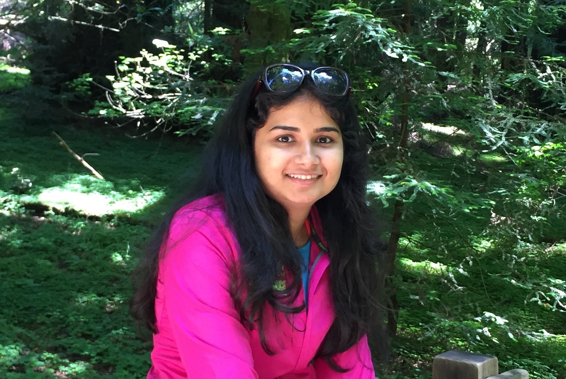 Woman in pink shirt smiling