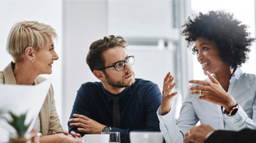 Three coworkers having a discussion