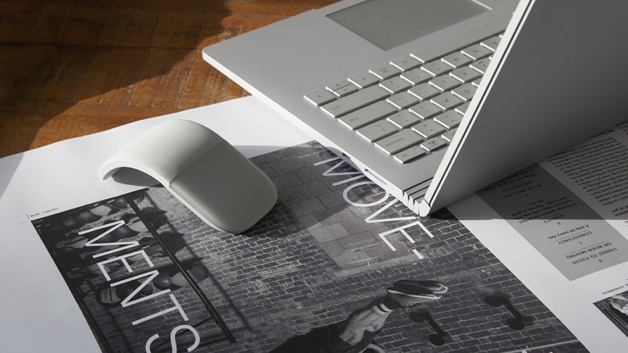 Laptop and mouse sitting on a desk