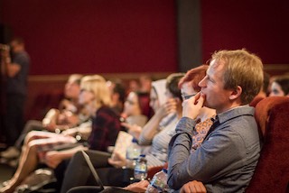 Attendees listening in rapt attention.