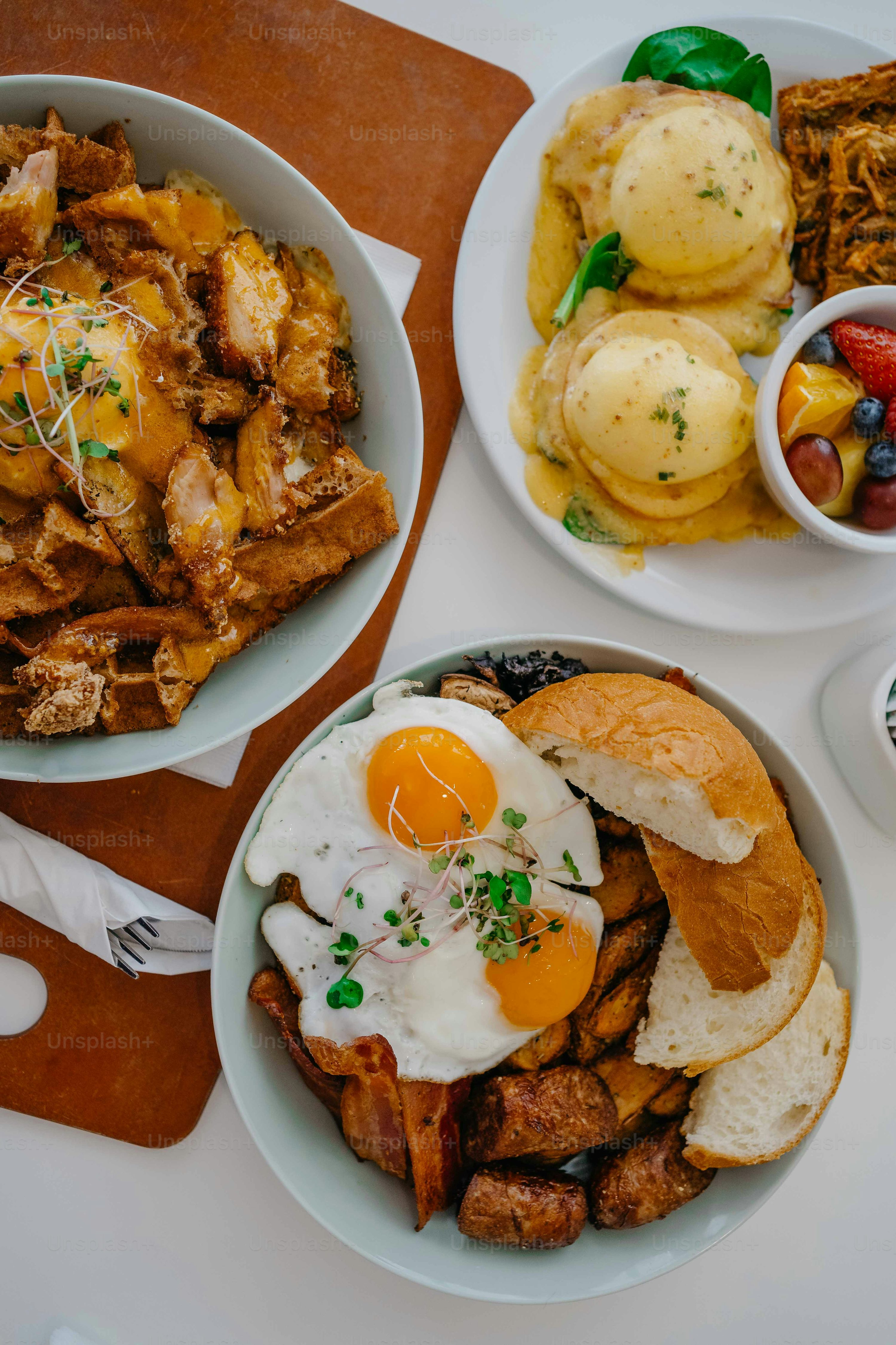 a table topped with plates of food and bowls of food