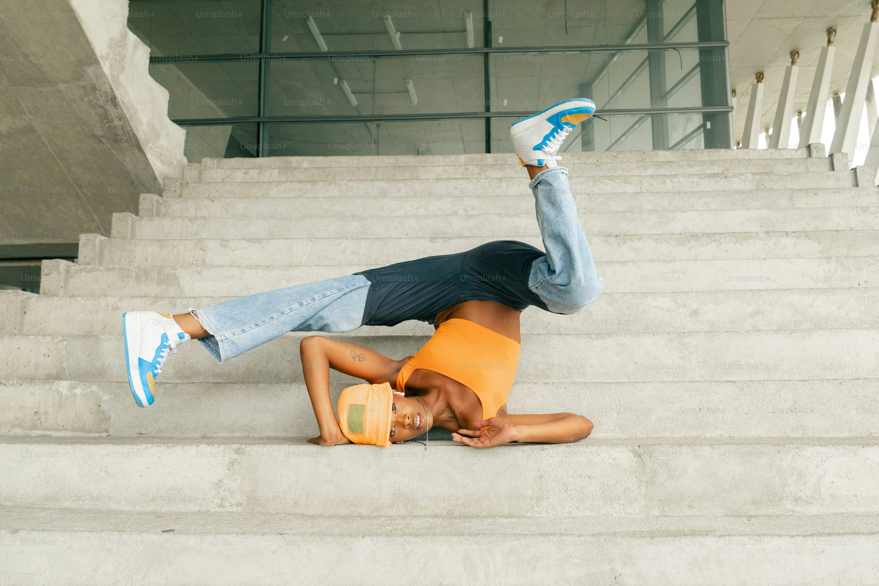 a man laying on top of a set of stairs