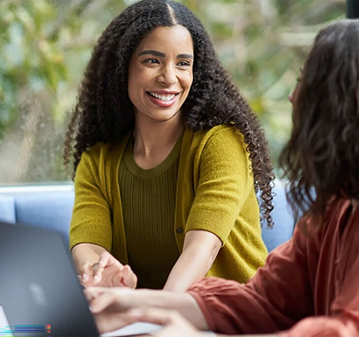 Two women talking at work