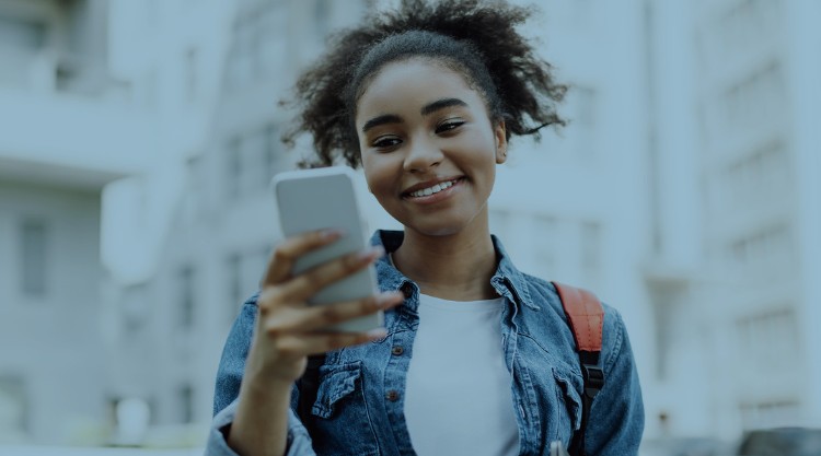 Girl Using Mobile Phone Standing Outside