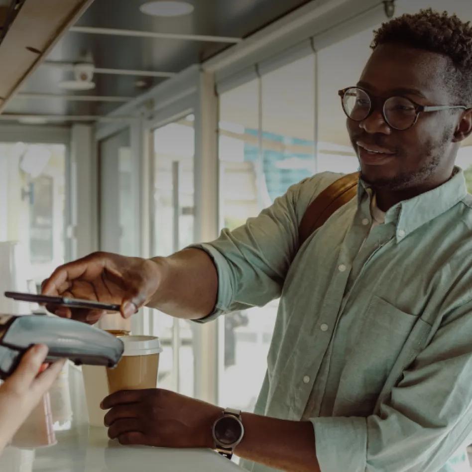 man scanning a credit card