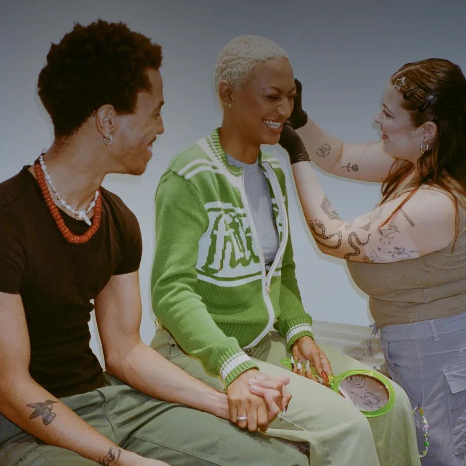 woman getting her ear pierced