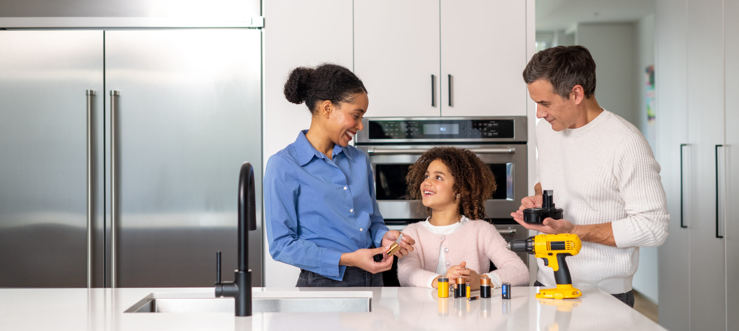 Dad, Mom, Daughter Protecting Batteries for environment