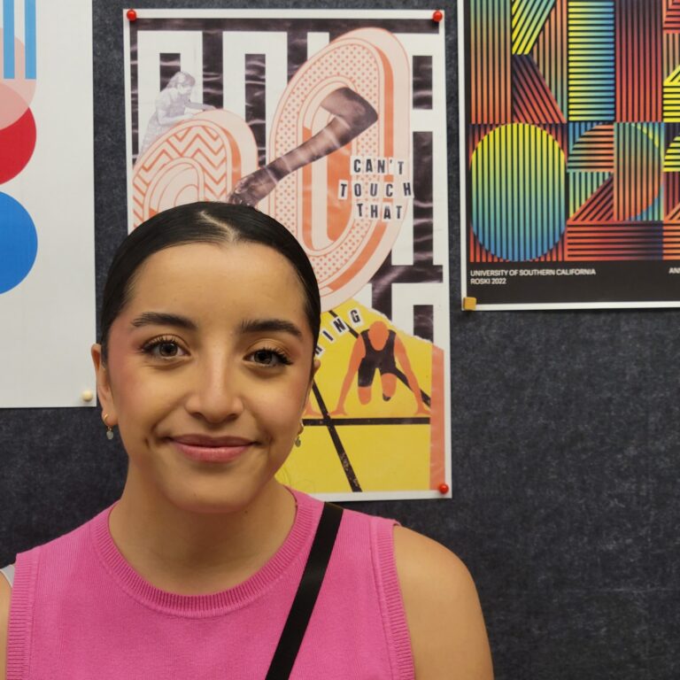 Image of student in front of their artwork