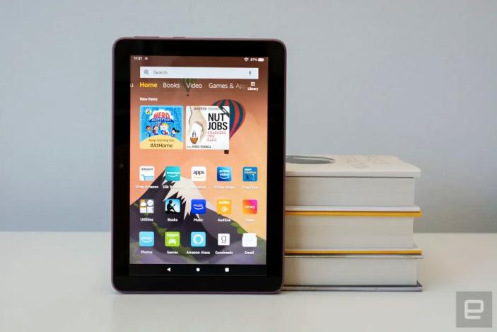 A tablet near books.