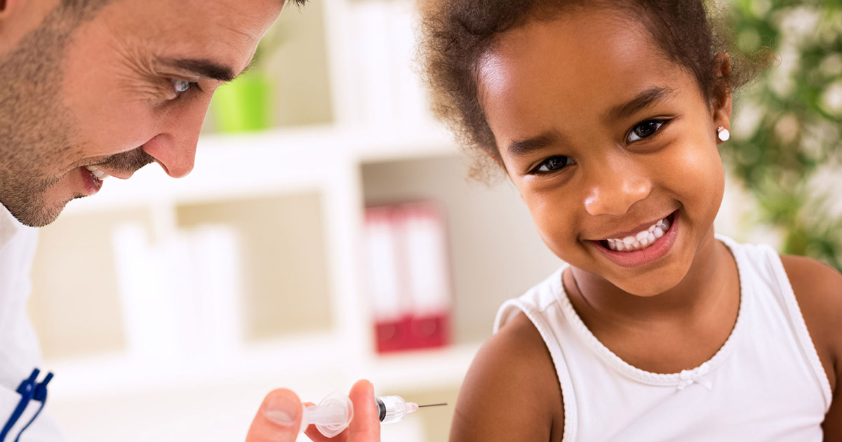 Young girl getting vaccinated