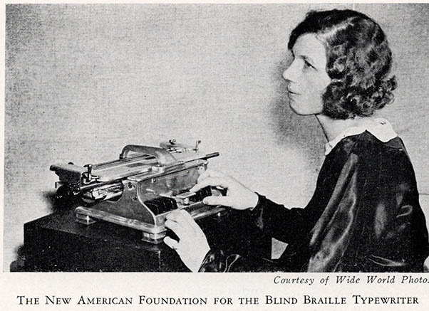 A young white woman uses a braille typewriter.