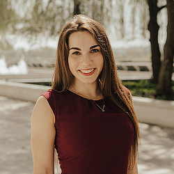 A woman smiling for the camera.