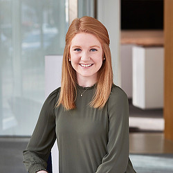 A woman smiling at the camera.