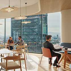 A group of people sitting at tables.