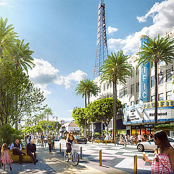 A group of people walking on a sidewalk at the Hollywood Walk of Fame next to a street with palm trees and buildings.