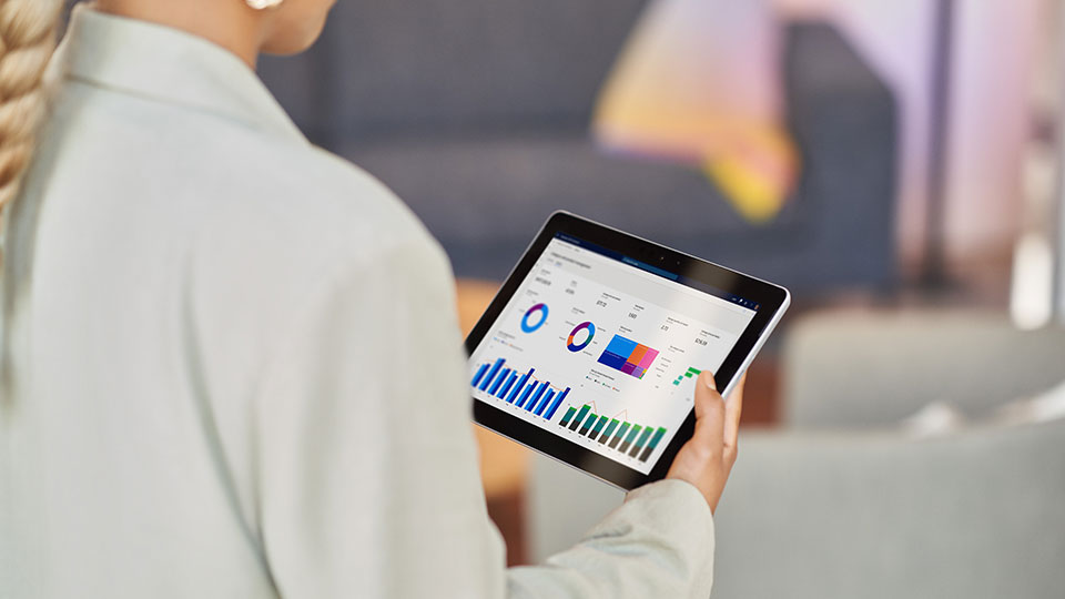 A woman reads data on a tablet