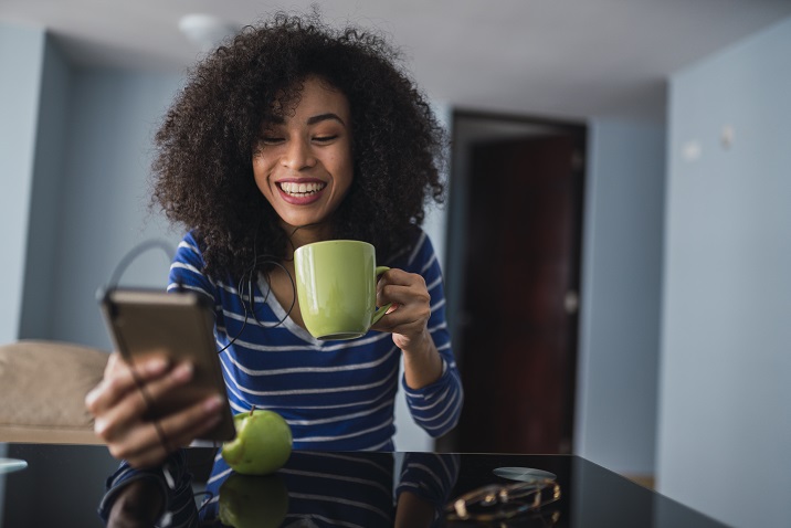 photo of a woman looking at her phone.