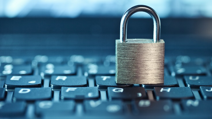 Photo of a lock resting on a keyboard