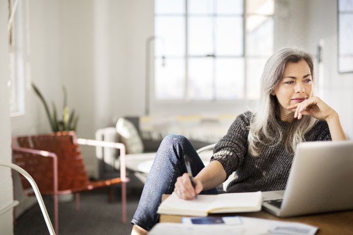 photo of a woman with a laptop and calendar