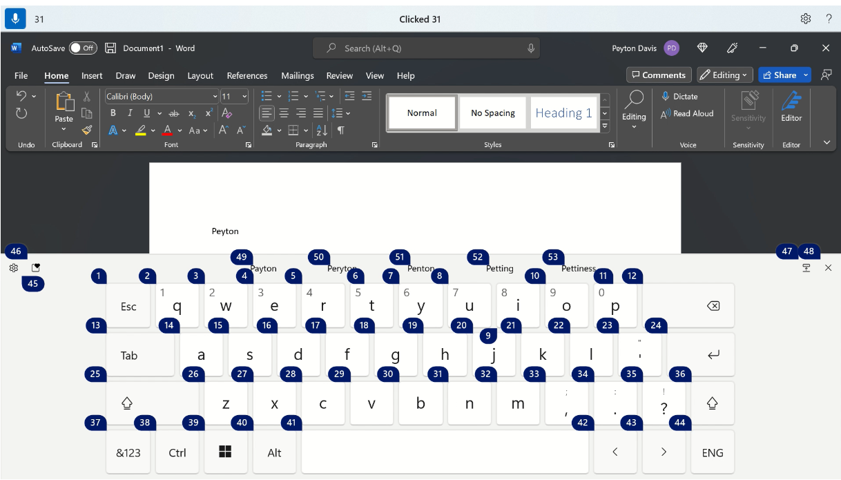 Keyboard sentuh Windows memperlihatkan overlay nomor akses suara untuk ejaan nama.