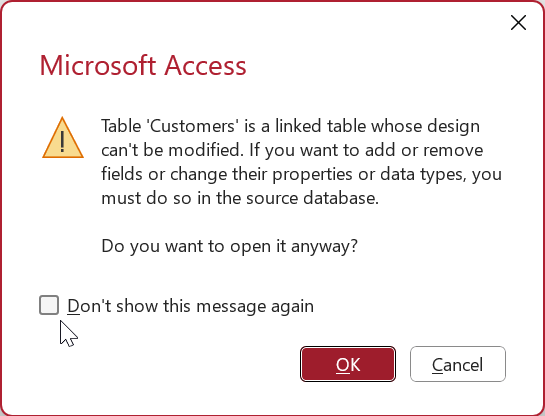 Advarsel i Access om åpning av en koblet tabell i utformingsvisning. En avmerkingsboks merket Ikke vis denne meldingen på nytt blir valgt.